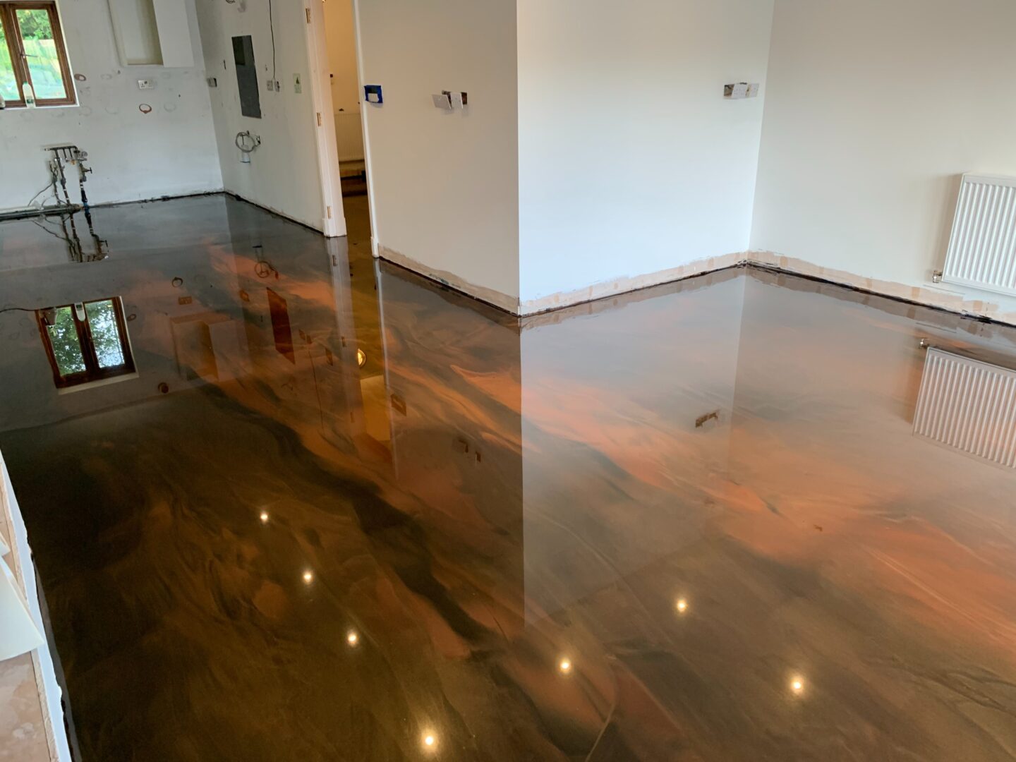 Glossy polished floor in empty modern room.