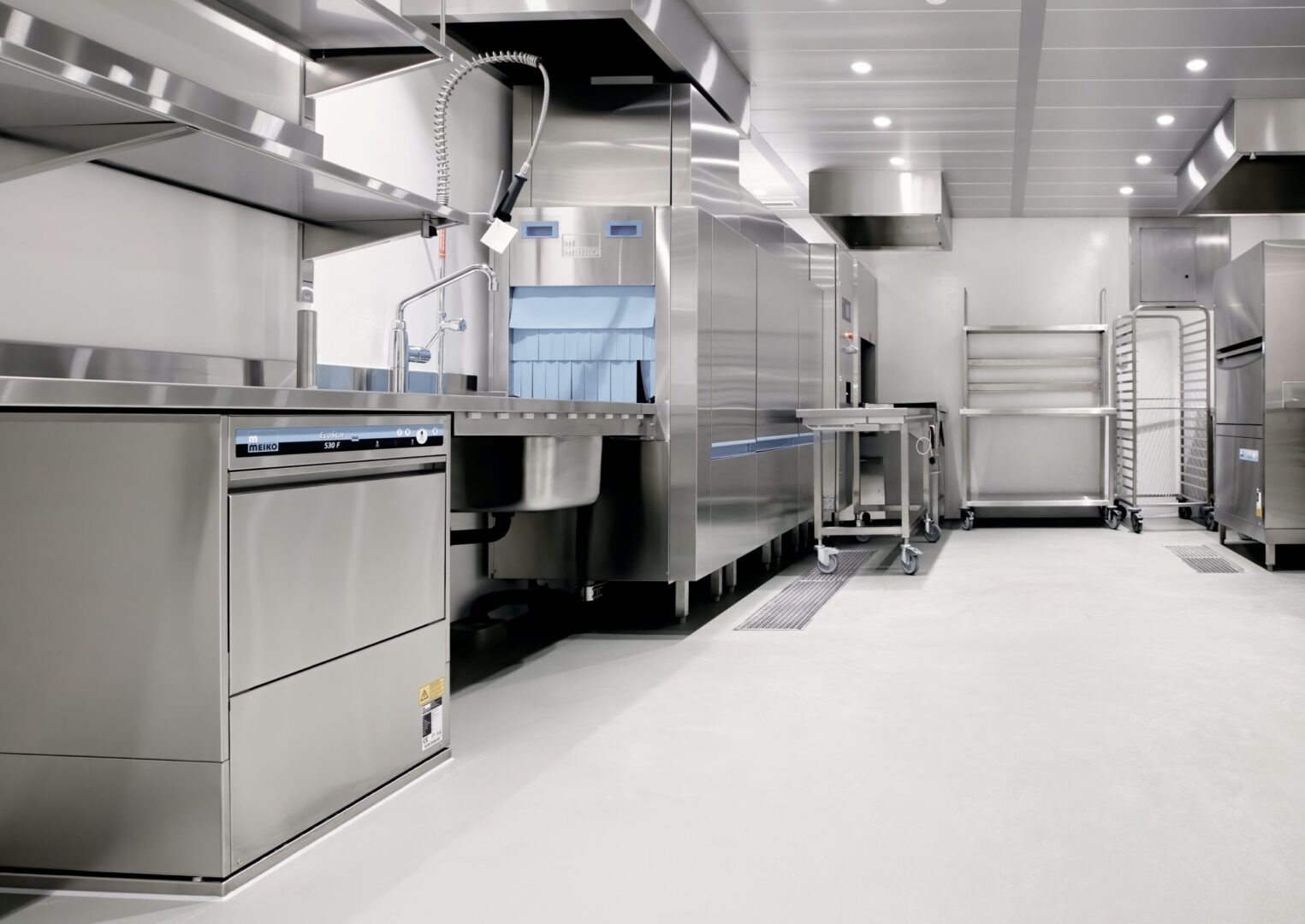 Commercial kitchen with stainless steel appliances.