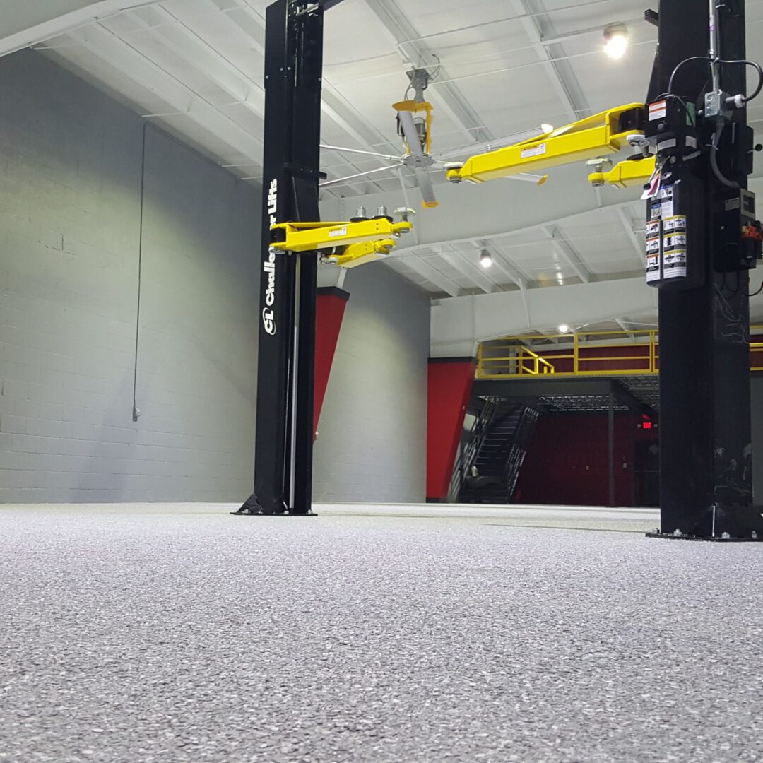 Empty garage with car lift installed.