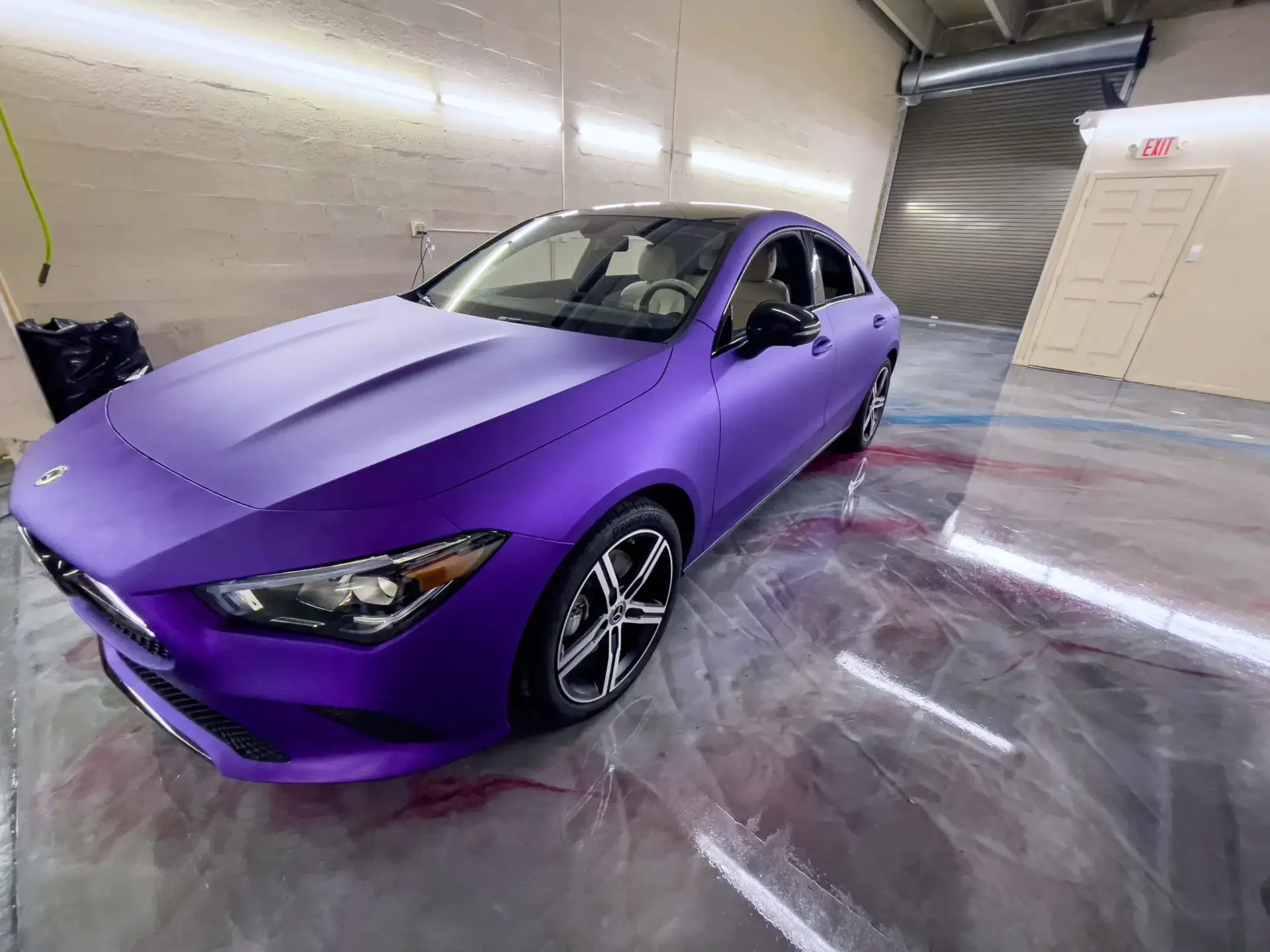 Purple car in a garage.
